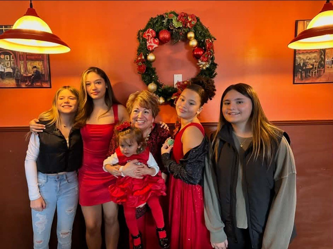 Mimma with her granddaughters at Christmas